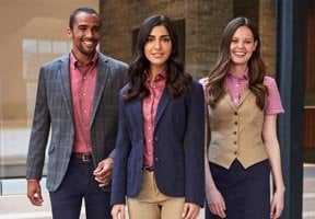 A man and two ladies dressed in business casualwear